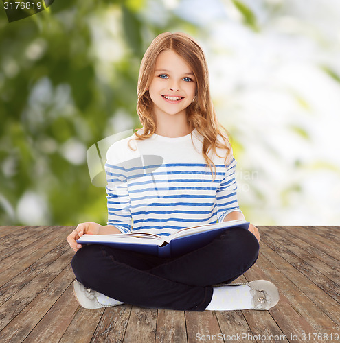 Image of student girl studying and reading book