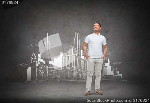 Image of smiling man over city sketch background