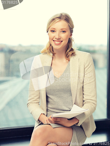 Image of happy woman with documents