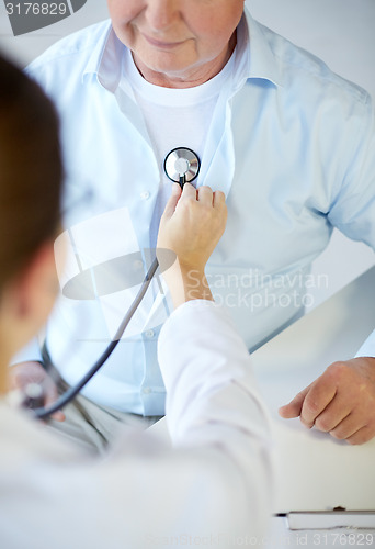 Image of close up of doctor with stethoscope and senior man