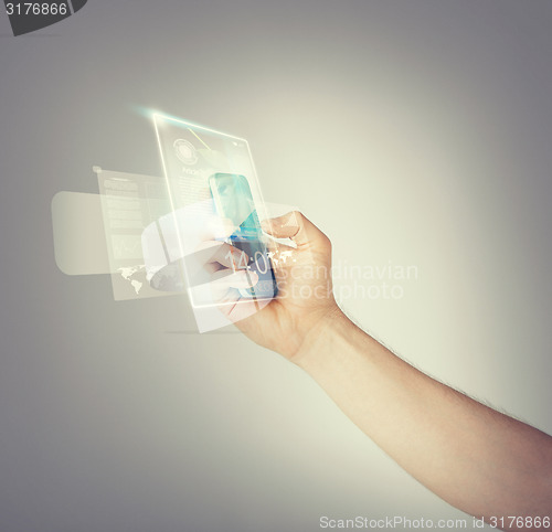 Image of man hand with smartphone and virtual screen