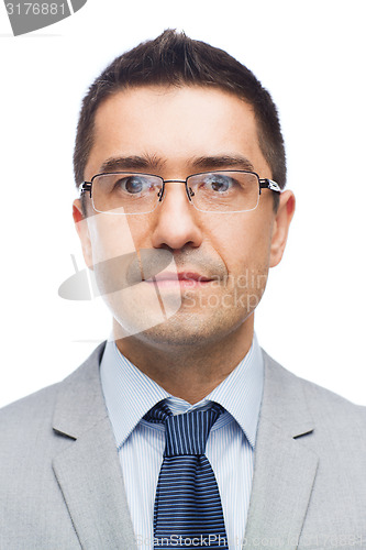 Image of happy smiling businessman in eyeglasses and suit