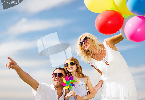 Image of family with colorful balloons