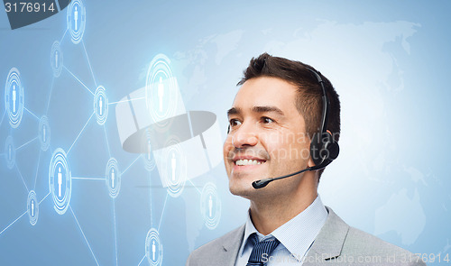 Image of smiling businessman in headset