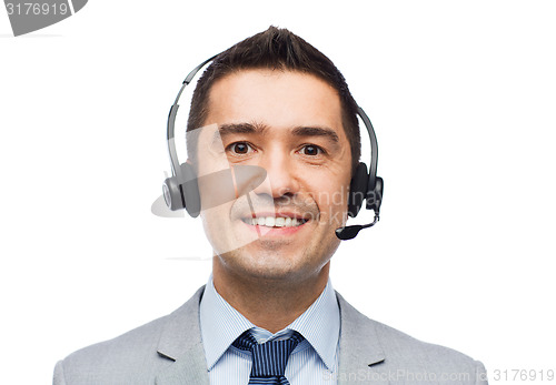 Image of smiling businessman in headset