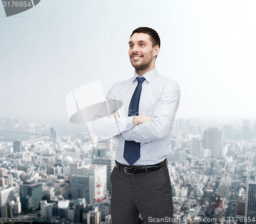 Image of handsome businessman with crossed arms