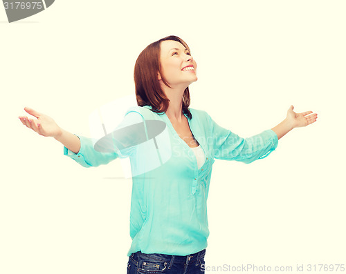 Image of smiling woman waving hands