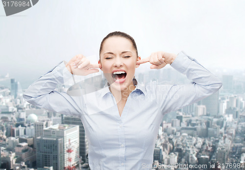 Image of angry screaming businesswoman