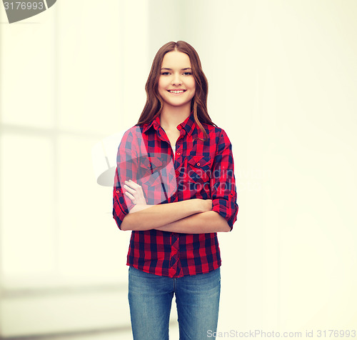 Image of smiling young woman in casual clothes