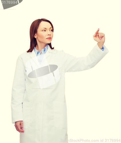 Image of doctor pointing to something or pressing button