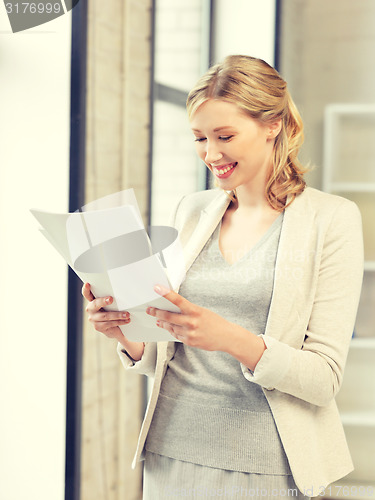 Image of happy woman with documents