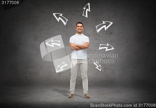 Image of smiling man over arrow doodles background