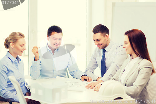 Image of happy team of architects and designers in office