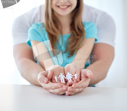 Image of close up of man and girl with cupped hands at home