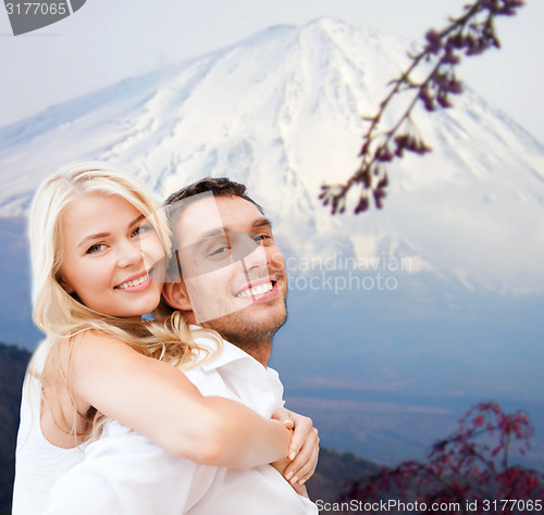 Image of couple having fun on the beach