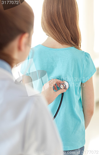 Image of close up of girl and doctor on medical exam