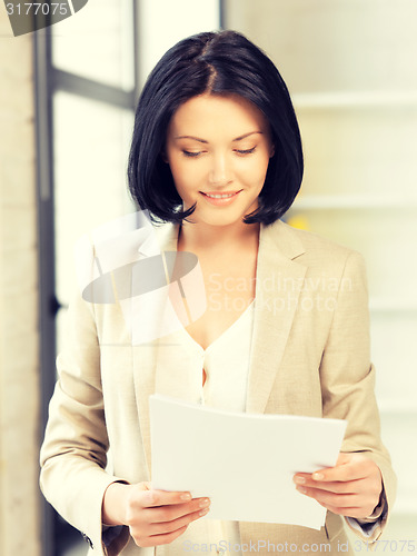 Image of happy woman with documents