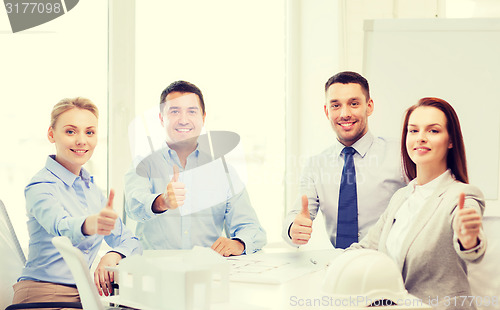 Image of happy team of architects and designers in office