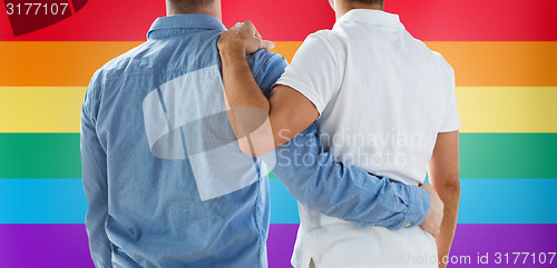 Image of close up of happy male gay couple hugging
