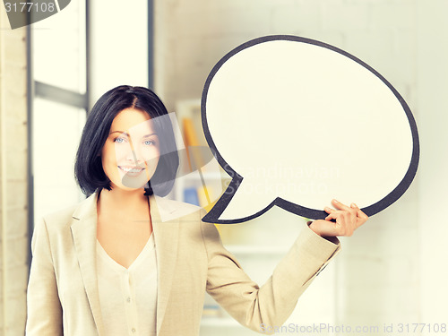 Image of smiling businesswoman with blank text bubble