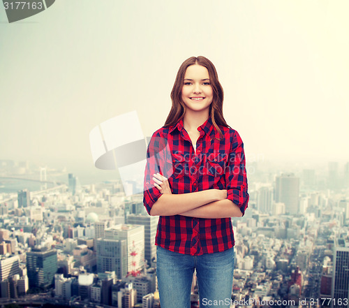 Image of smiling young woman in casual clothes