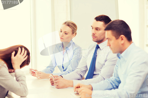 Image of businesswoman getting fired in office