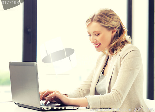 Image of happy woman with laptop computer