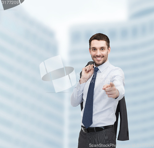 Image of handsome buisnessman with jacket over shoulder