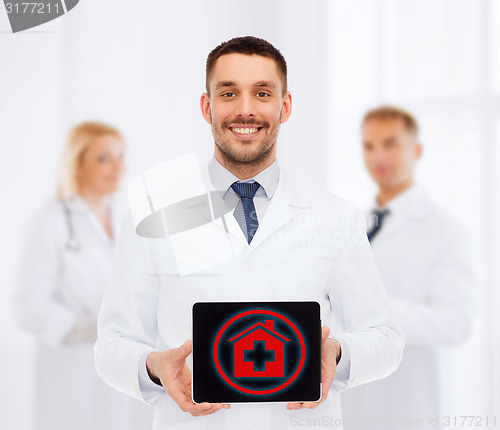 Image of smiling male doctor with tablet pc