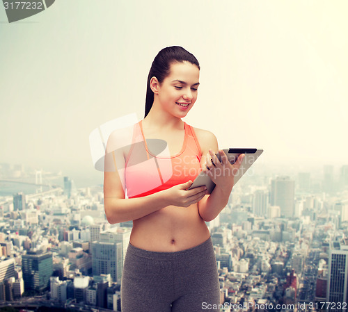 Image of sporty woman with tablet pc computer