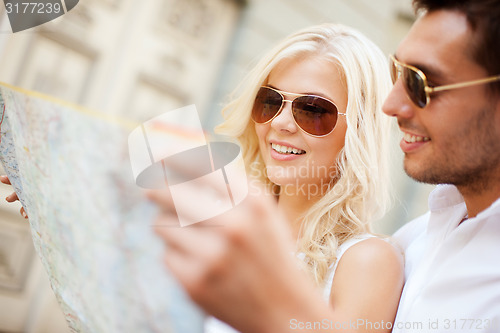 Image of couple with map in the city