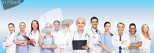 Image of smiling female doctors and nurses with stethoscope