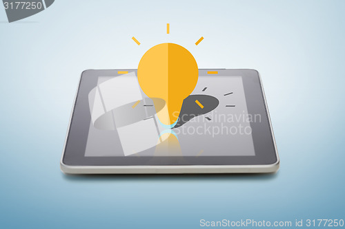 Image of tablet pc with lightning bulb icon over screen