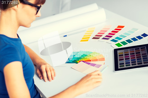 Image of woman working with color samples for selection