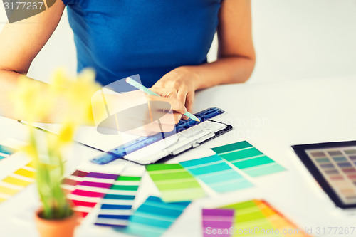 Image of woman working with color samples for selection