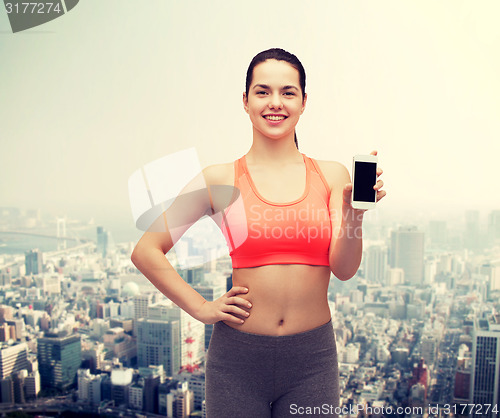 Image of sporty woman with smartphone