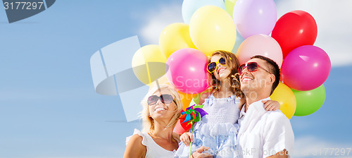 Image of family with colorful balloons