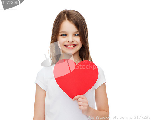 Image of smiling little girl with red heart