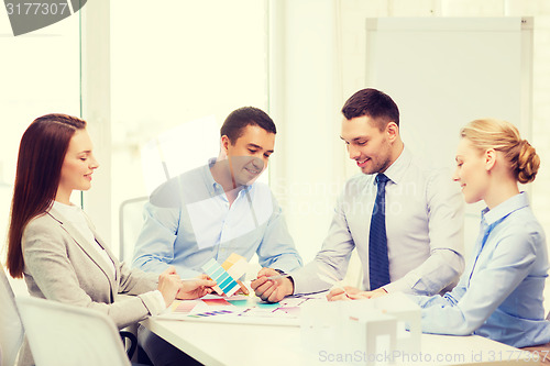 Image of happy team of architects and designers in office