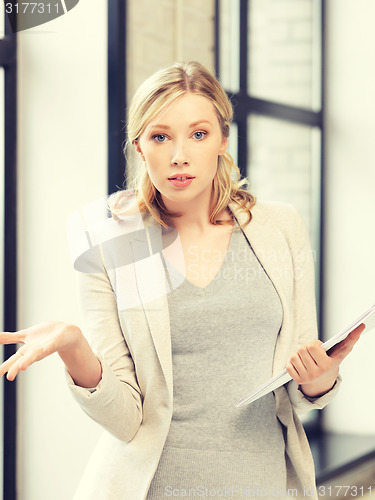 Image of worried woman with documents