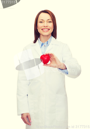 Image of smiling female doctor with heart