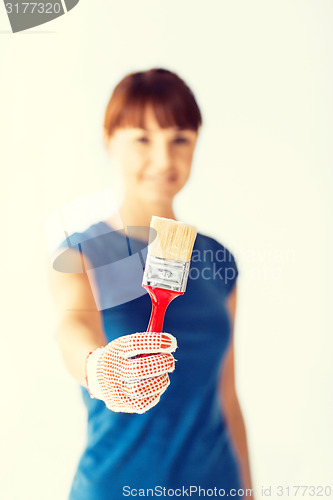 Image of woman with paintbrush