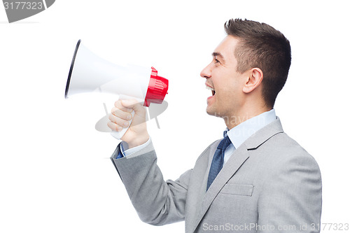 Image of happy businessman in suit speaking to megaphone