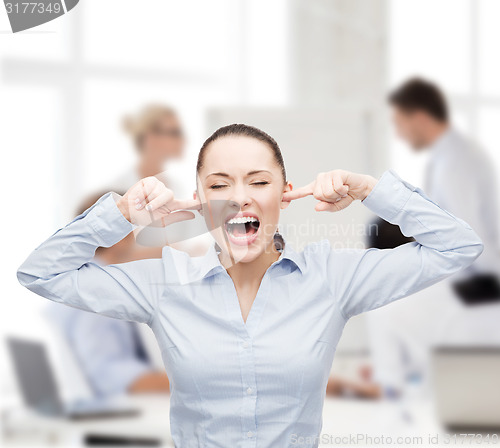 Image of angry screaming businesswoman