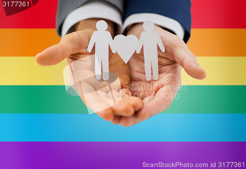 Image of close up of happy male gay couple with love symbol