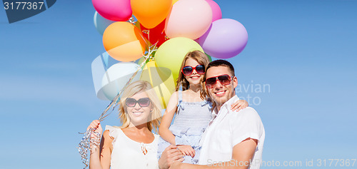 Image of family with colorful balloons