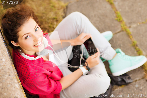 Image of girl with headphones listening to music