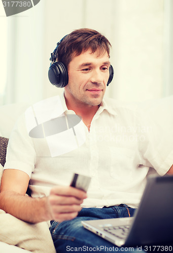 Image of man with headphones listening to music
