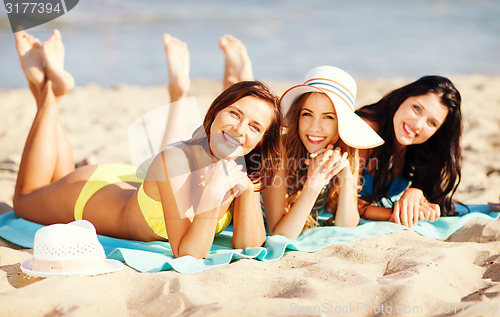 Image of girls sunbathing on the beach