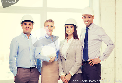 Image of happy business team in office